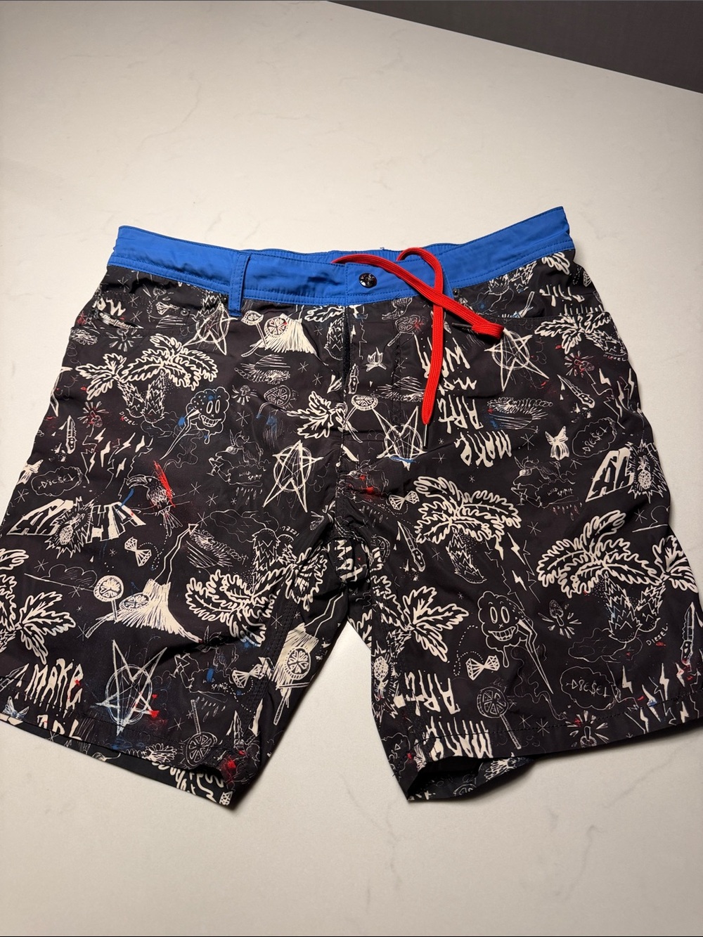 Diesel Men's Black Graphic Swim Trunks with Blue Waistband and Red Drawstring